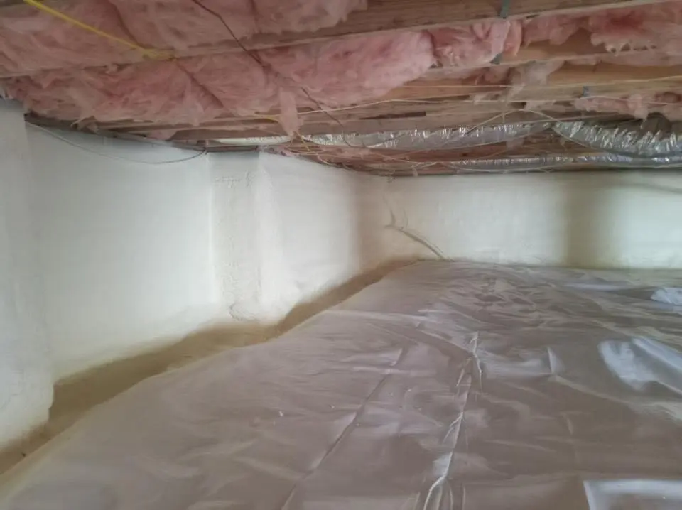Crawl space encapsulation with closed-cell spray foam for Commercial Roof Restoration in Great Neck